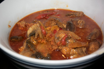close up red spicy curry