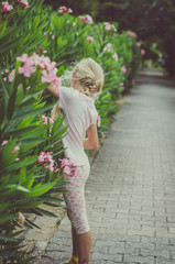 child and oleander flowers