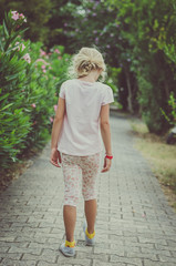 child and oleander flowers