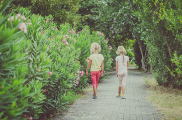child and oleander flowers