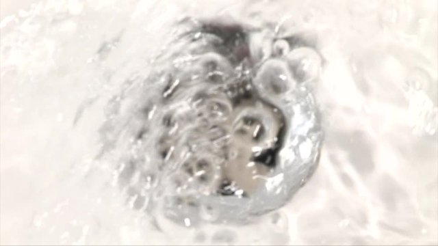 Water going down a plug hole northern hemisphere bathroom  