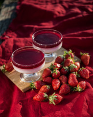 Fresh strawberry jelly on old wooden background. Tasty healthy vegetarian dessert sugar free. 
