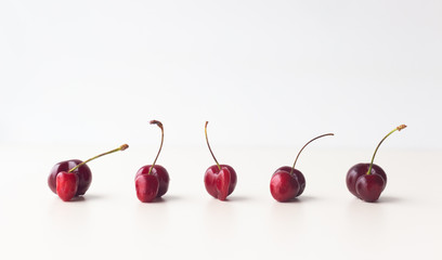 Obraz na płótnie Canvas Unusual sweet cherries in a row.