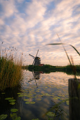 Amazing sunrise of beautiful windmills at Kinderdijk, The Netherlands during sunrise, no tourists due to Covid-19