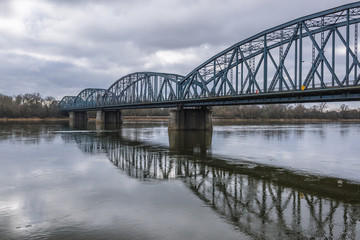 Fototapeta na wymiar River Vistula with bridge of Josef Pilusdski in Torun city, Poland
