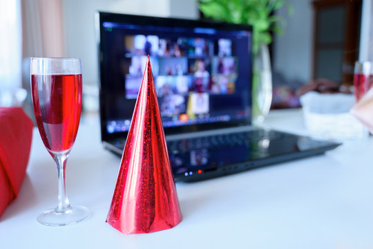 Red Holiday Hat,glass Of Juice.Kids Virtual Birthday Party.Celebration Of Holiday At Home On Isolation.Online Conference,video Call In Laptop,computer.Animator,cookies.Quarantine,coronavirus Covid-19