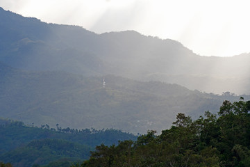Cloudy sunset over jungle covered mountain, Philippines © It4All