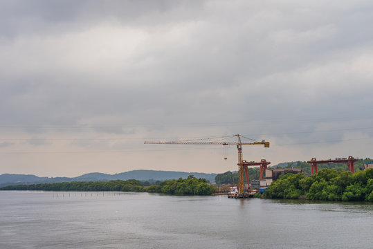 Borim,Goa/India- May 1 2020: Barges carrying mining ore for export at Borim, Goa.