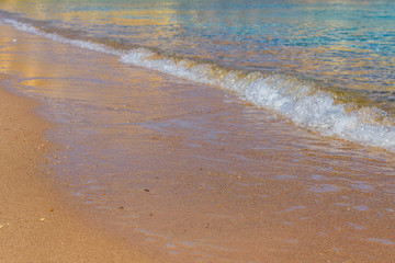Closeup of the sand on beach and Red sea water