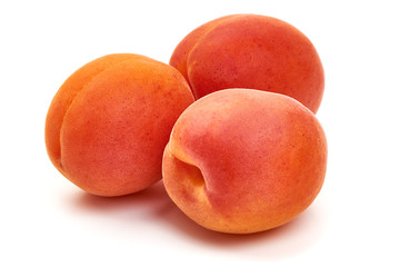 Fototapeta na wymiar Sweet juicy apricots, ripe nectarines, isolated on white background