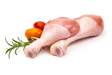 Raw chicken drumsticks, isolated on white background