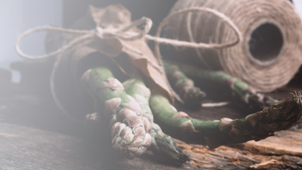 Bunch of fresh asparagus on wooden table