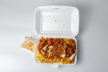 Close-up of the food called Chicken Biryani in foam box White background