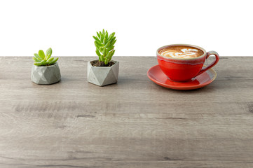Succulent plants gardening and latte art coffee. Red ceramic cup on a light wooden background. Background menu in the coffee shop, relaxing time holidays. 