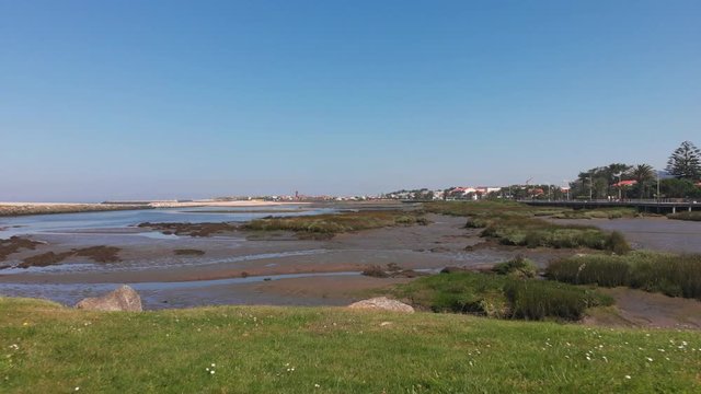 DRONE The two sides of Restinga de Ofir. One facing the ocean, the other the estuary of C&aacute;vado River. The jetty structure that protects the coastline from the currents and tides in Esposende, Portugal