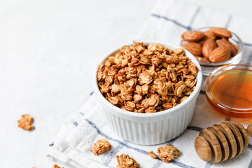 Homemade oatmeal granola bowl on white background.