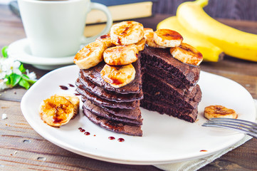 Pancakes with chocolate and slices of banana