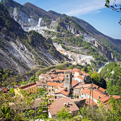 The famous village of Colonnata between white marble quarries of Carrara in the Apuan Alps. Massa...