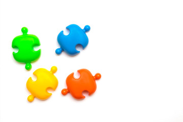 Multicolored puzzles on a white background.Social distance concept to prevent the spread of coronavirus Covid-19.