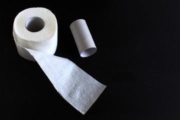toilet paper on black background