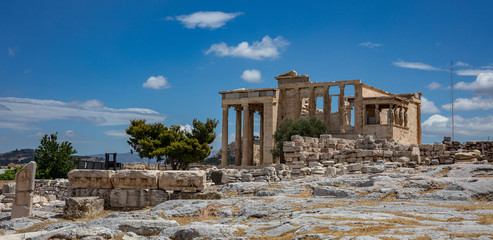 Athens, Greece. Erechtheion with Caryatid Porch on Acropolis hill, blue sky background