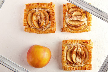 Delicious Puff with apples and cinnamon on a white background, strudel