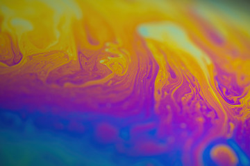 Abstract iridescent wave background. Soap bubble texture