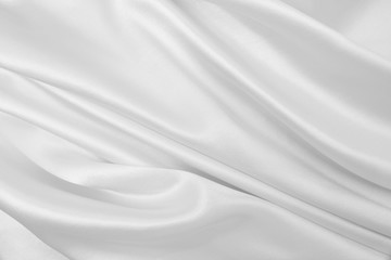 Smooth elegant white silk or satin luxury cloth texture as wedding background. Luxurious background design