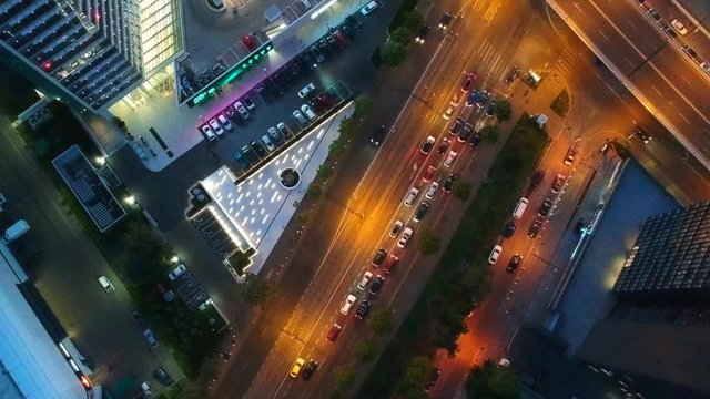 Aerial drone vertical view of Bucharest city centre square traffic hour at night