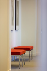 Red seats in office waiting area