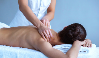 Close-up of traditional healing and recreation massaging treatments. Health, skin care, massage, osteopathy and manual therapy.