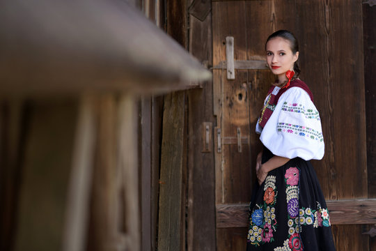 Young beautiful slovak woman in traditional costume. Slovak folklore.