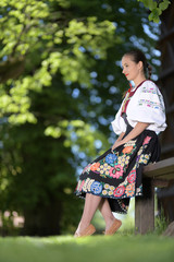 Young beautiful slovak woman in traditional costume. Slovak folklore.