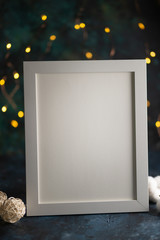 White frame for design, layout, Mockup. Against the background of night lights, with designer...