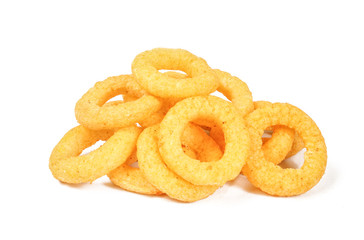 Delicious ring snacks isolated on white background. Pile of yellow unhealthy junk food