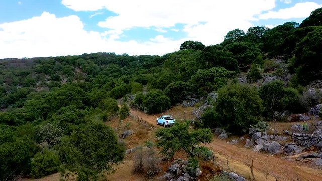 white pick up in mountain