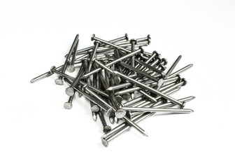 Pile of silver metallic nails isolated on white background.