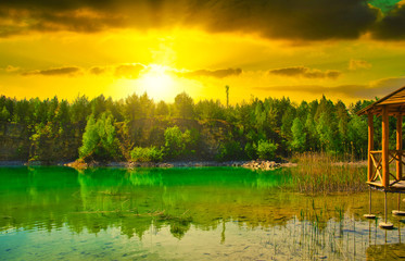 A turquoise lake on sunset. Travel and rest concept. Wonderful views and extraordinary places on earth, sunrise.