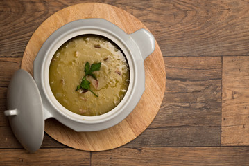 Pea soup on the wooden table