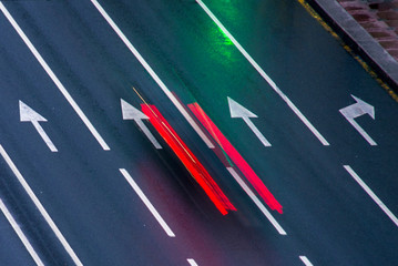 Road markings with blurred car lights © Eugene