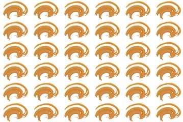 Pattern from abstract grained handful of golden coloured sand.