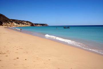 Fototapeta na wymiar almost empty beach in Luz at the Algarve coast
