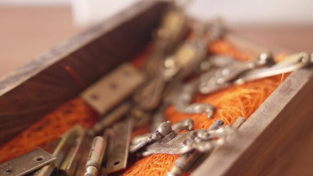 old wooden drawer with antique vintage door hinges inside for restoration