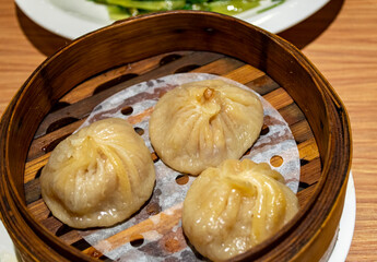 Chinese soup dumplings (Tang Bao) in a bamboo steamer from China local restaurant