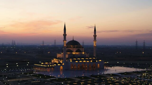 Aerial view of illuminated Al Farooq Omar Bin Al Khattam Mosque in Dubai, UAE.
