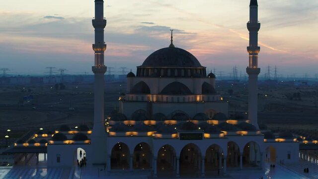 Aerial view of illuminated Al Farooq Omar Bin Al Khattam Mosque in Dubai, UAE.