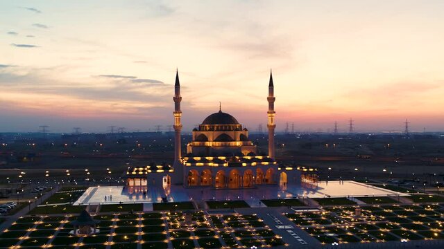 Aerial view of illuminated Al Farooq Omar Bin Al Khattam Mosque in Dubai, UAE.
