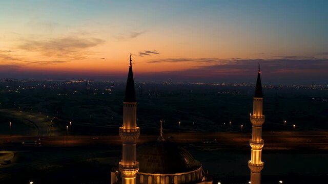 Aerial view of illuminated Al Farooq Omar Bin Al Khattam Mosque in Dubai, UAE.