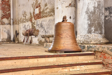 Fototapeta premium church bell lies on floor, bell on stairs