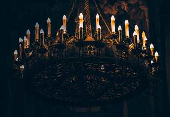 church ceiling candelabrum, candelabra with candles - obrazy, fototapety, plakaty
